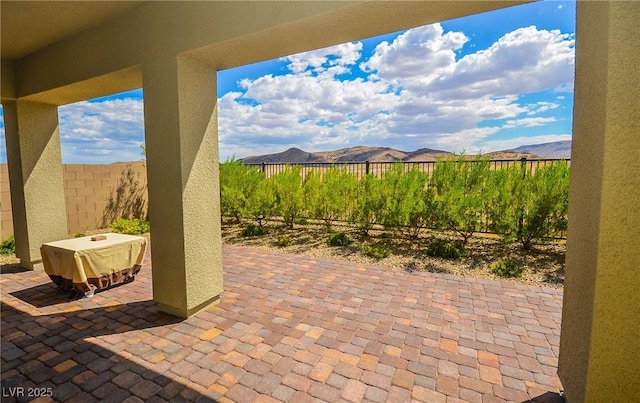 view of patio / terrace with a mountain view