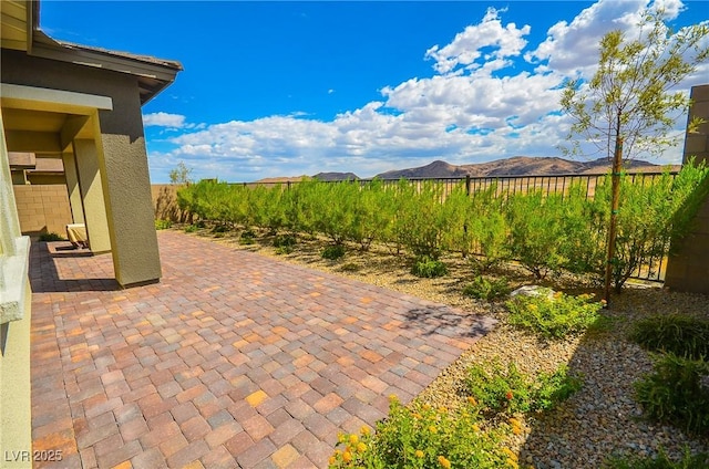 view of patio / terrace with a mountain view