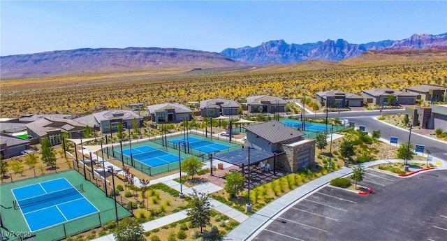 birds eye view of property with a mountain view