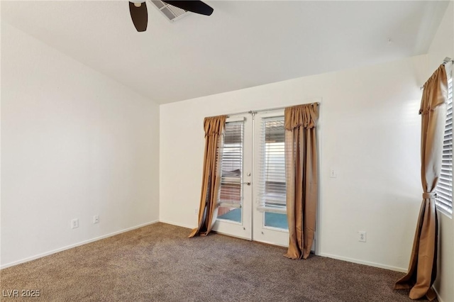 carpeted empty room with ceiling fan and french doors