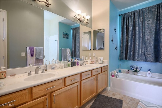 bathroom featuring tile patterned floors, a washtub, and vanity