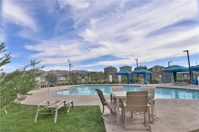 view of swimming pool featuring a gazebo, a yard, and a patio