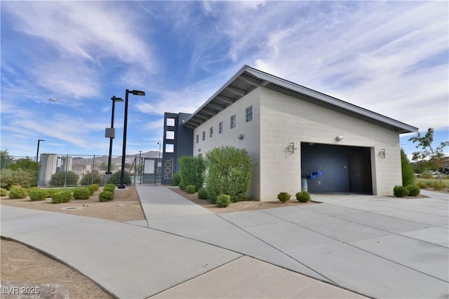 view of side of property with a garage