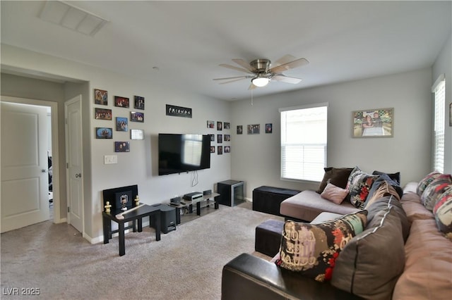 living room with light carpet and ceiling fan