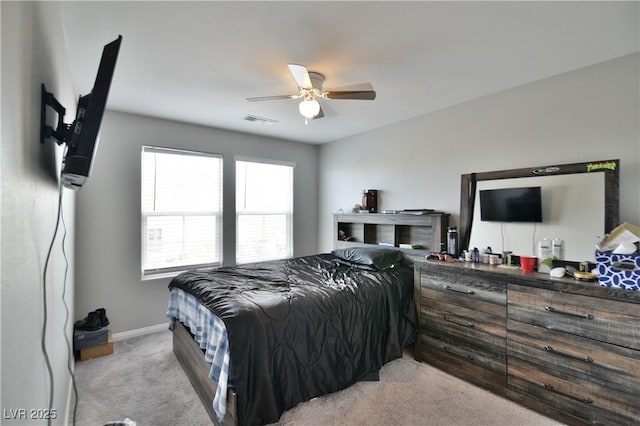 bedroom featuring light colored carpet and ceiling fan