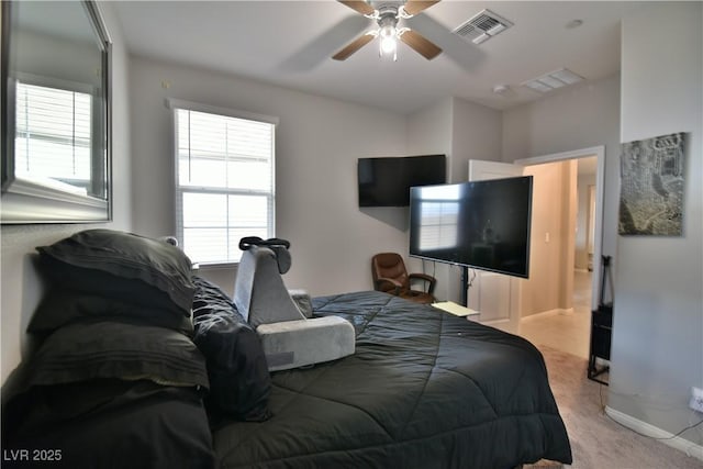 bedroom with ceiling fan and light colored carpet