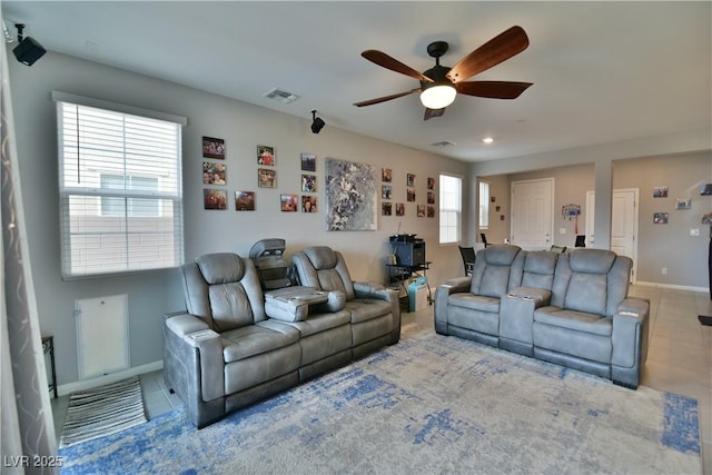 tiled living room featuring ceiling fan