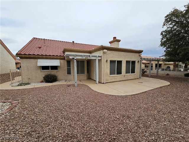 back of house featuring a pergola and a patio