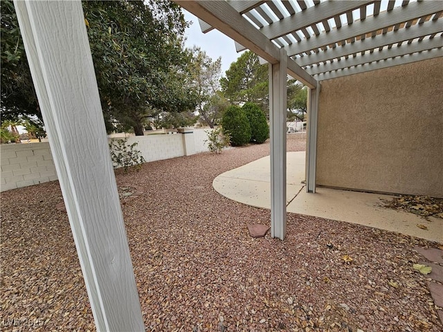 view of yard with a patio area and a pergola