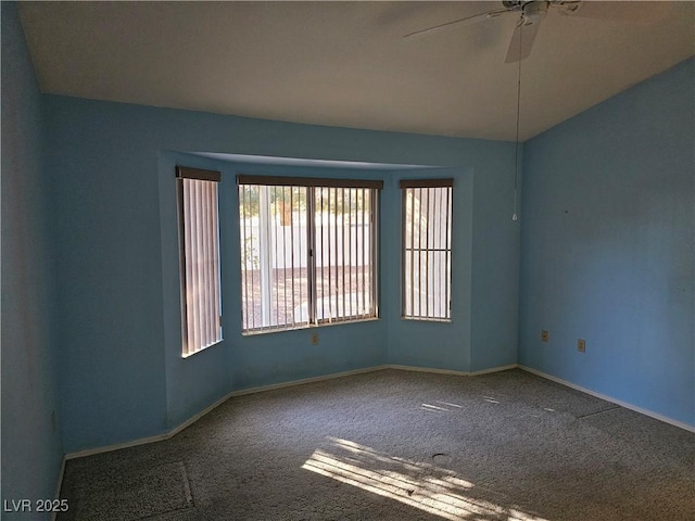 empty room featuring carpet and ceiling fan