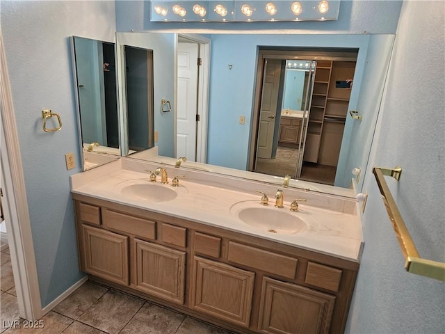 bathroom with tile patterned floors, vanity, and toilet