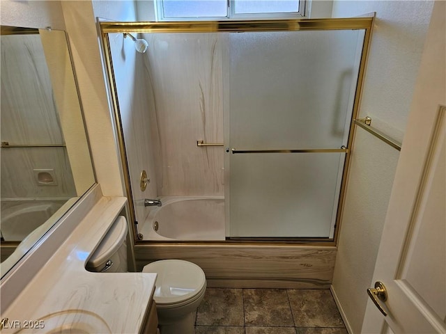 full bathroom with combined bath / shower with glass door, vanity, and toilet