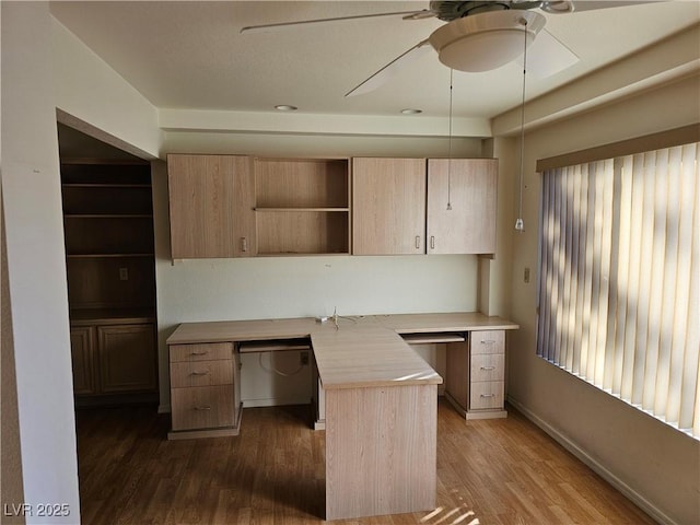 kitchen featuring butcher block counters, ceiling fan, light brown cabinets, and dark wood-type flooring