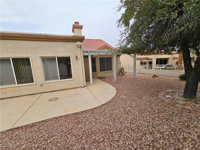 rear view of house with a patio