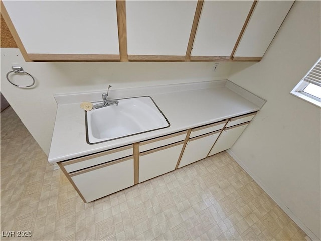 laundry area featuring sink