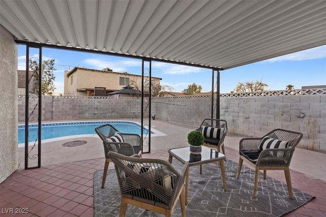 view of patio featuring a fenced in pool