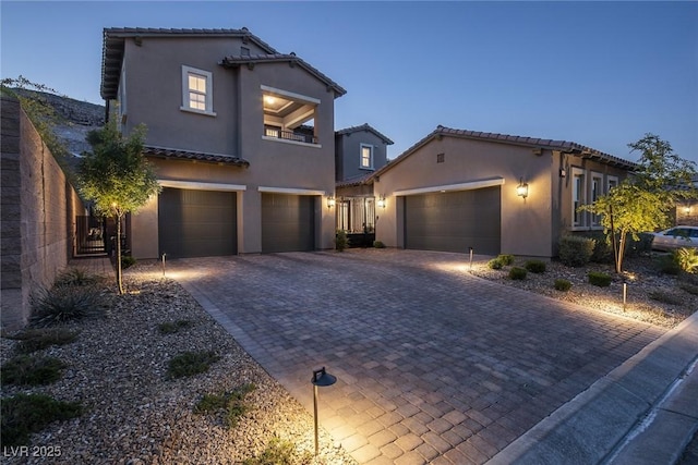 mediterranean / spanish house with a garage