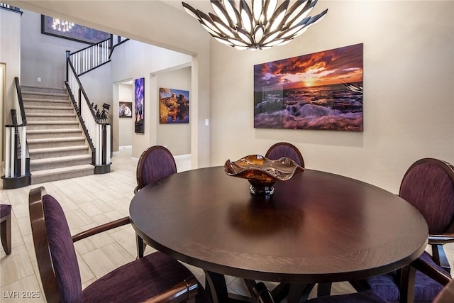 dining space featuring an inviting chandelier