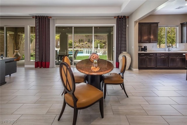 dining space featuring sink