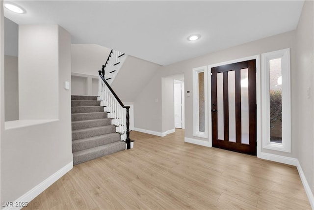 foyer with light hardwood / wood-style floors