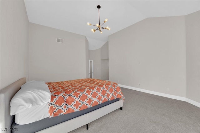 carpeted bedroom featuring lofted ceiling and an inviting chandelier