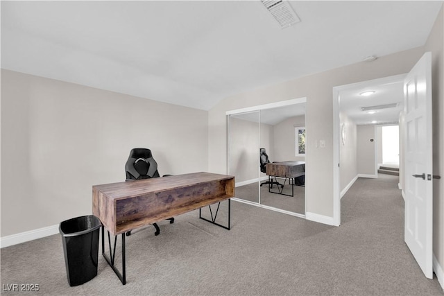 carpeted office with vaulted ceiling