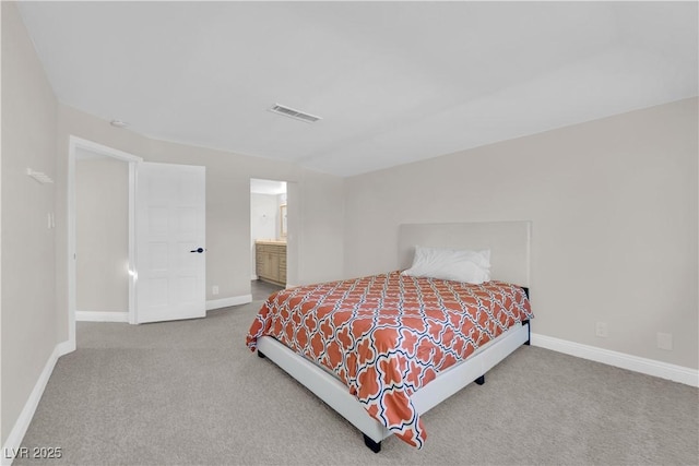 bedroom with carpet flooring and ensuite bathroom