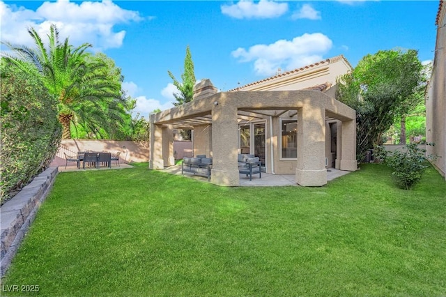 back of house featuring a pergola, a patio area, an outdoor living space, and a yard