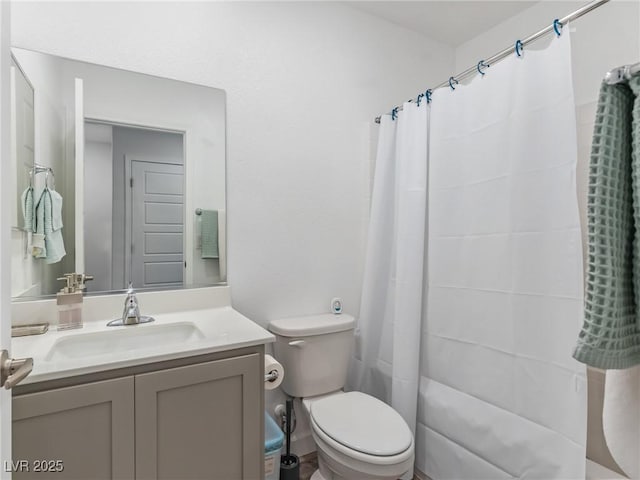 full bathroom with shower / bath combo, vanity, and toilet