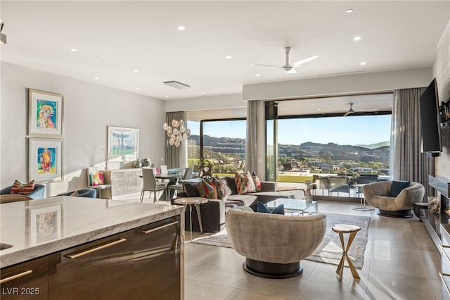 tiled living room featuring ceiling fan