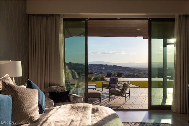 bedroom featuring a mountain view and tile patterned flooring