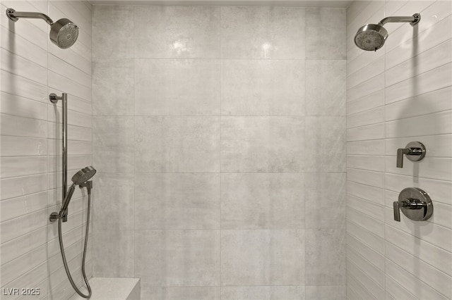 bathroom with a tile shower