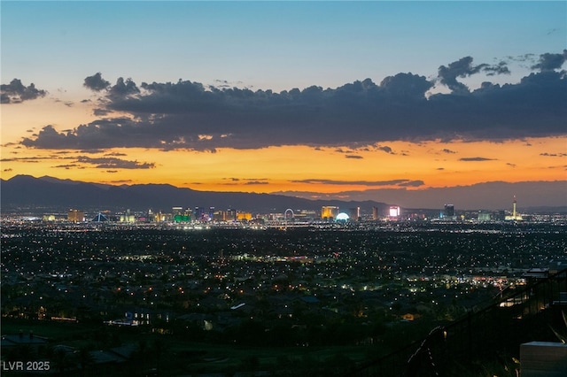 property's view of city with a mountain view