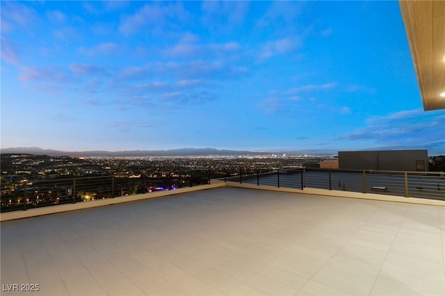 view of patio terrace at dusk