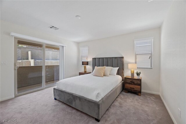 carpeted bedroom featuring access to outside