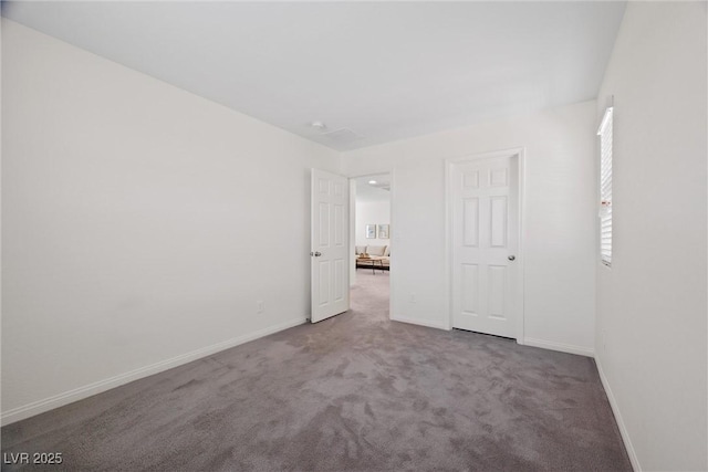 unfurnished bedroom with carpet floors