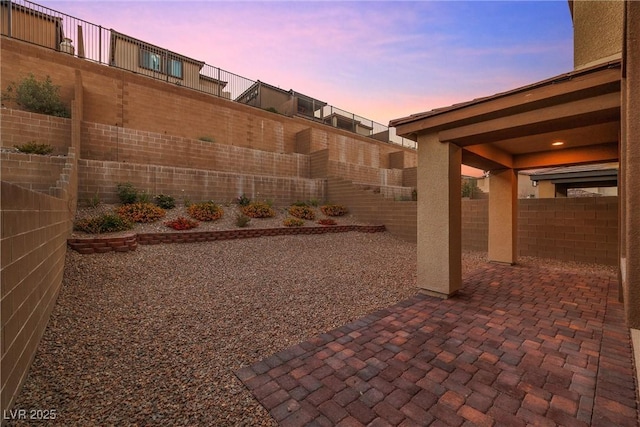 view of patio terrace at dusk