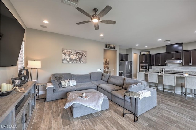 living room with ceiling fan