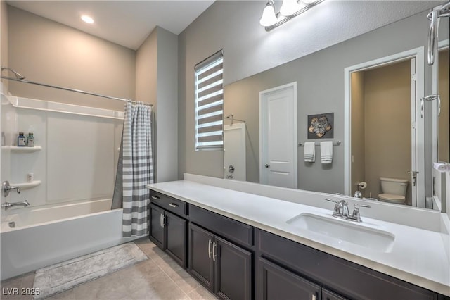 full bathroom featuring tile patterned flooring, vanity, toilet, and shower / bath combo