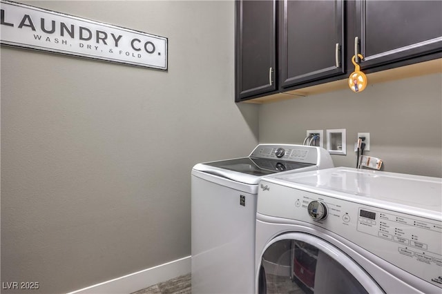 laundry area with cabinets and independent washer and dryer