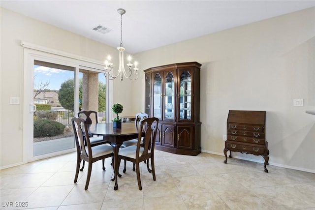 dining space featuring light tile patterned flooring, visible vents, baseboards, and an inviting chandelier