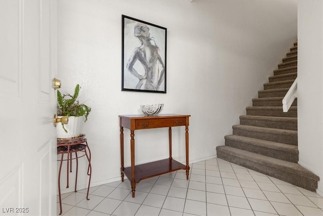 stairs featuring tile patterned flooring