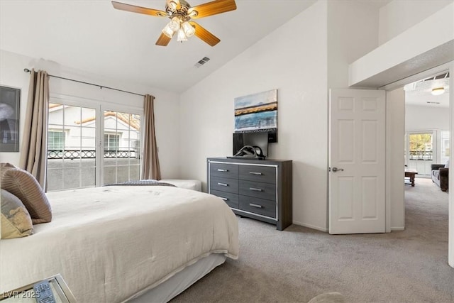 bedroom with ceiling fan, light colored carpet, and vaulted ceiling