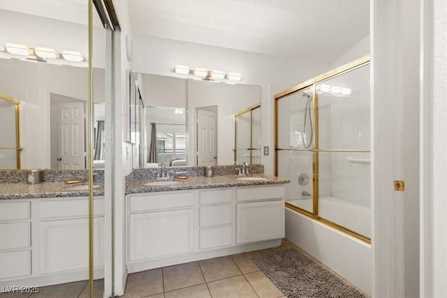 bathroom with tile patterned flooring, vanity, lofted ceiling, and shower / bath combination with glass door