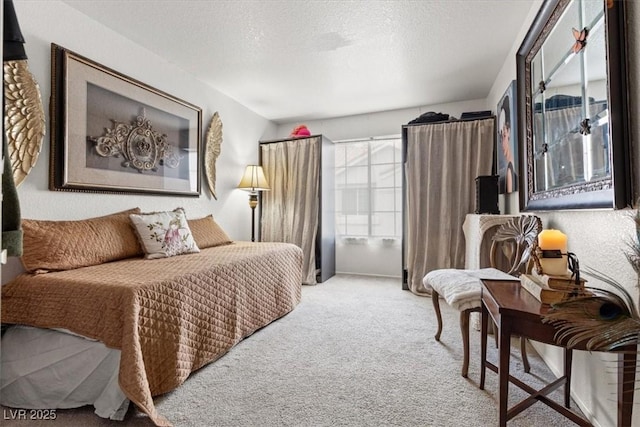 carpeted bedroom featuring a textured ceiling