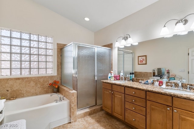 bathroom featuring tile patterned floors, vanity, lofted ceiling, and independent shower and bath