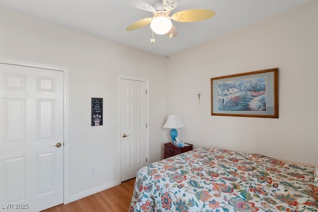 bedroom featuring ceiling fan and light hardwood / wood-style floors