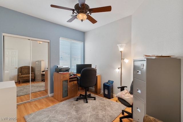 home office featuring ceiling fan and light wood-type flooring