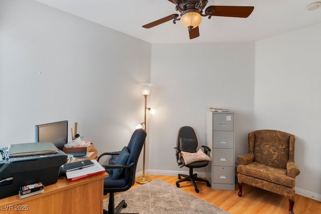 office space featuring ceiling fan and light hardwood / wood-style floors