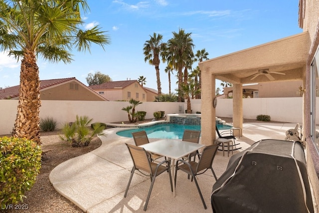 view of pool featuring an in ground hot tub, area for grilling, ceiling fan, and a patio area